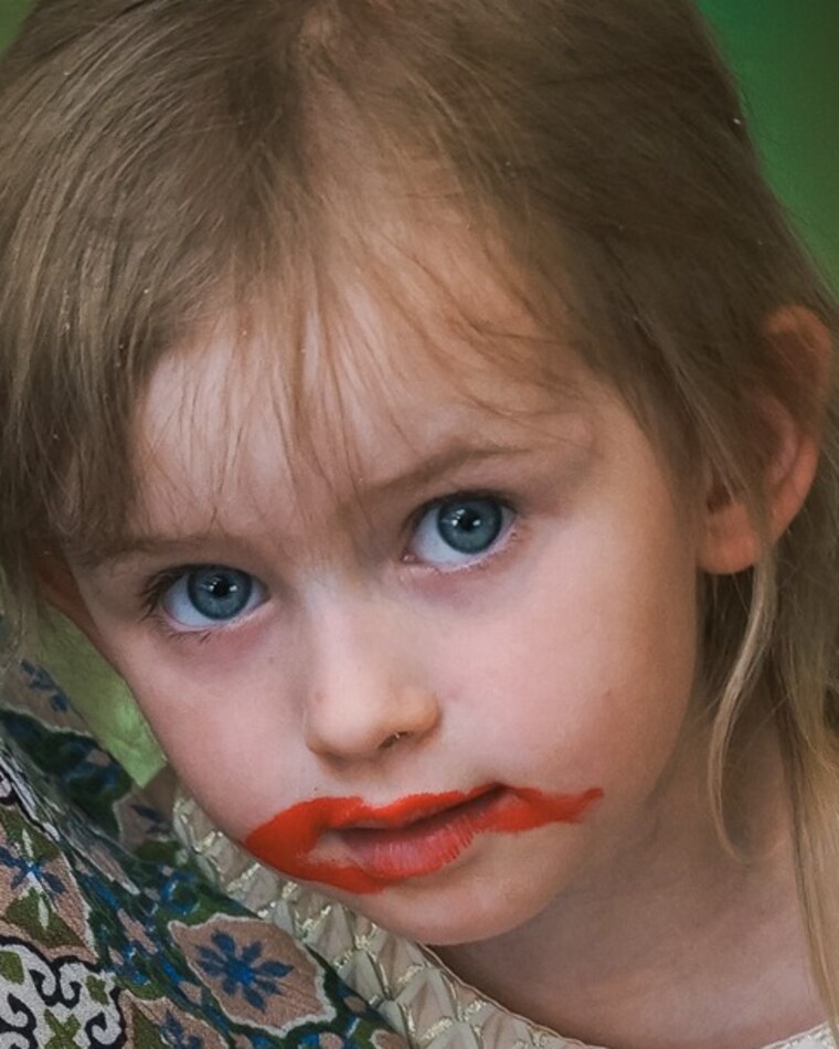 Candid close-up of a little girl who got into the lipstick during a TaraLens Media fall mini session in Sacramento