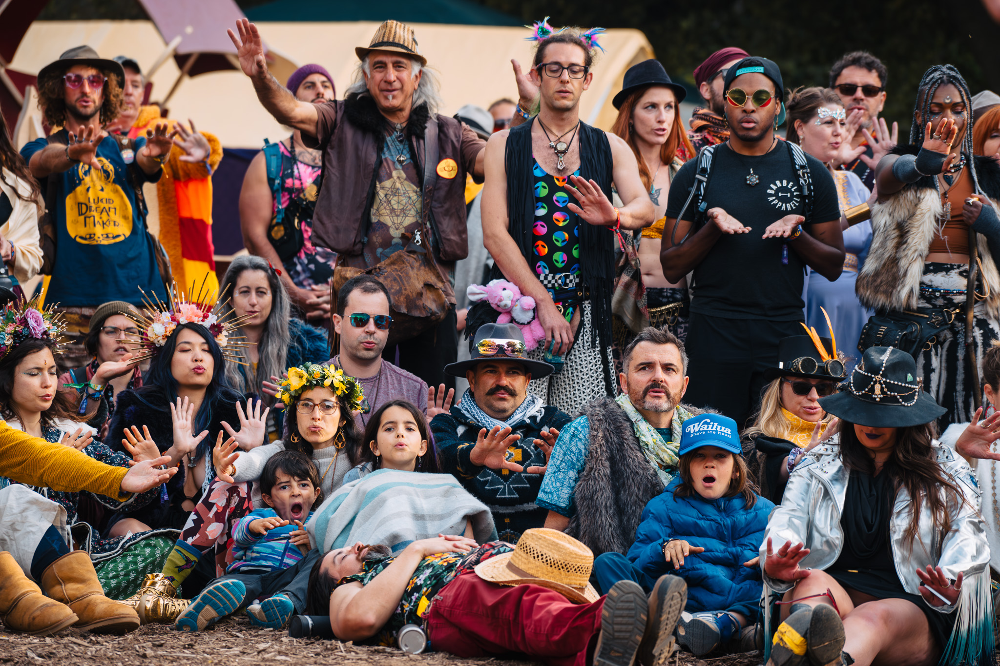 A group of festival attendees gathered together — community portrait at an outdoor music festival