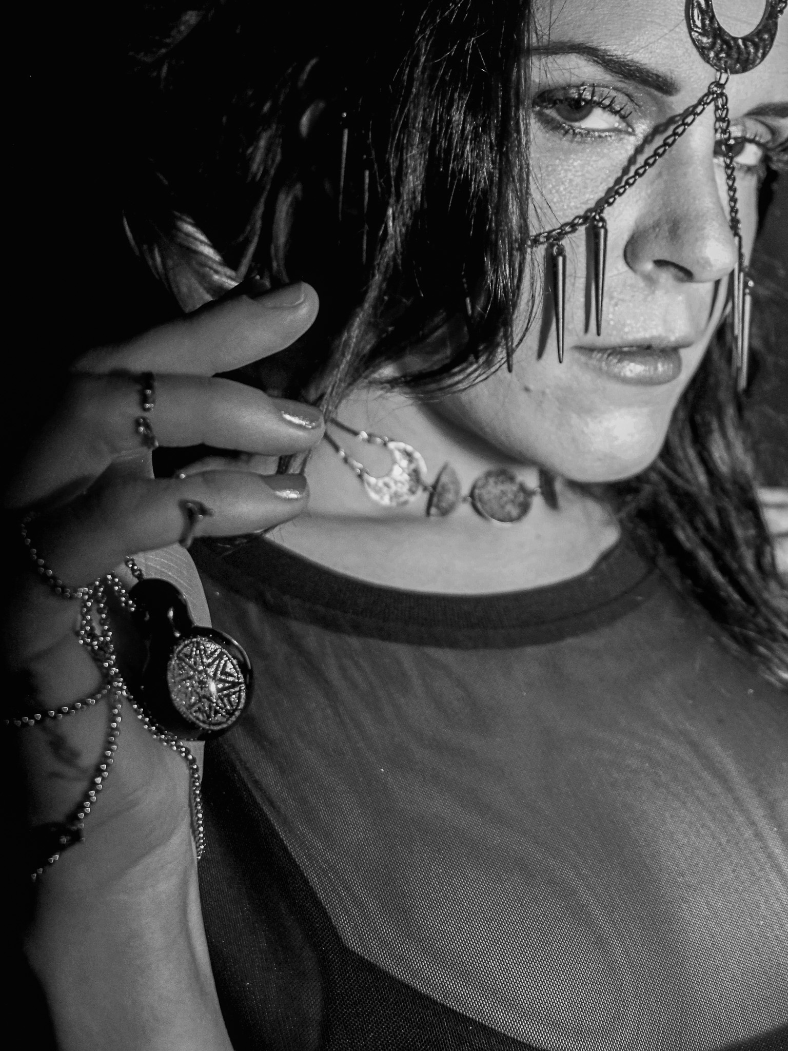 Brand campaign portrait photography featuring jewelry and accessories in dramatic editorial light