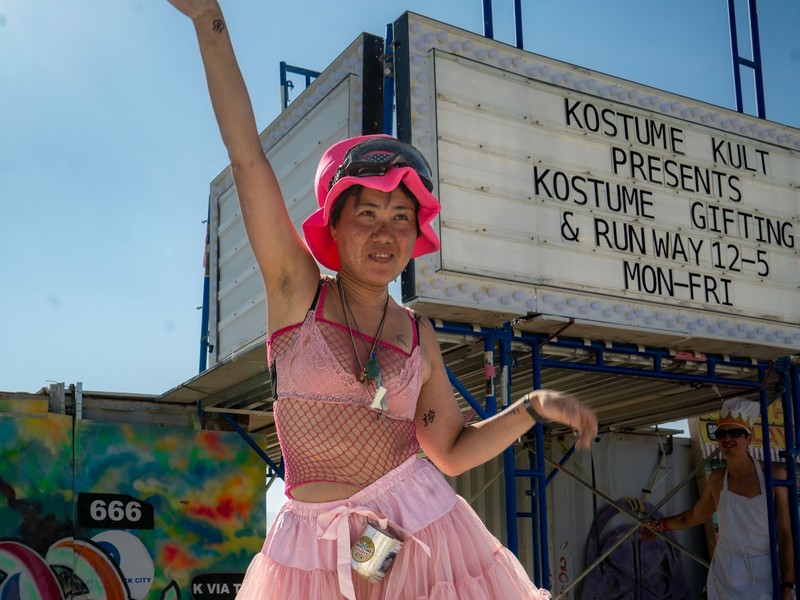 A dancer in a pink costume at the Kostume Kult gifting camp at Burning Man