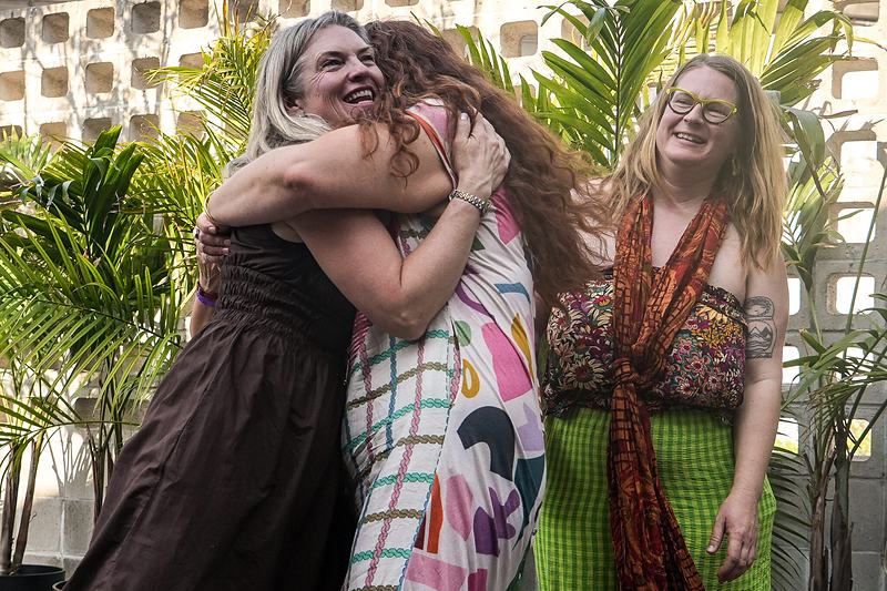A singer performs with eyes closed at an intimate outdoor jazz gathering, live music photography by Tara Lenehan