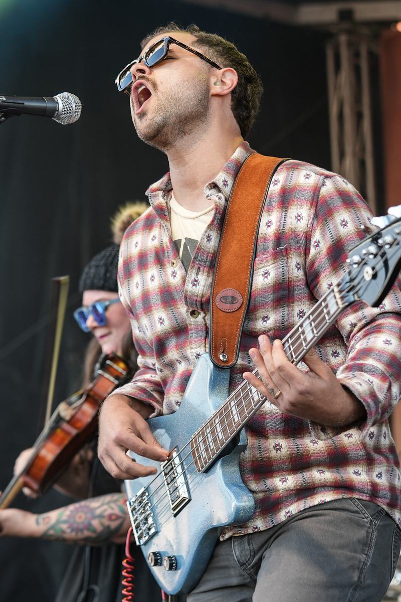 Electric guitarist in plaid performing at the RendezVan 2026 music festival in Bend