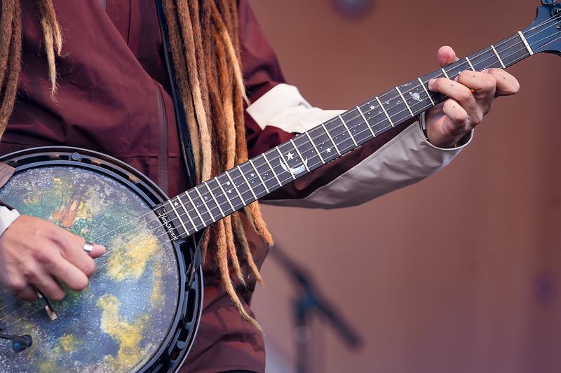 Galaxy-painted banjo closeup — detail shot, live music photography